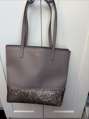 kate spade taupe tote with glitter-bottom trim